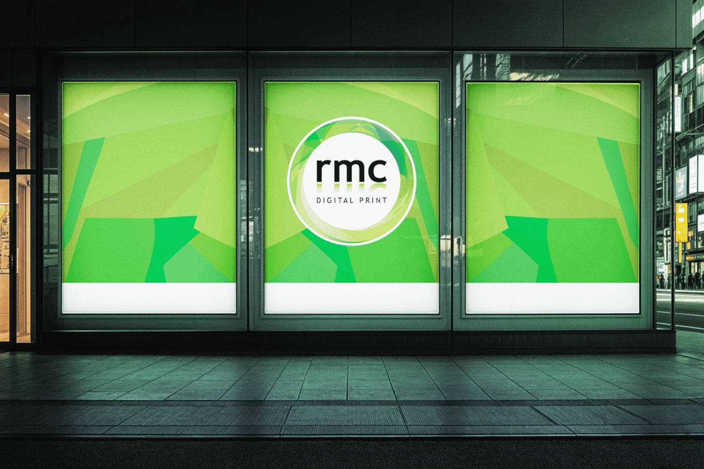 Backlit window lightbox displays in a shopfront at night